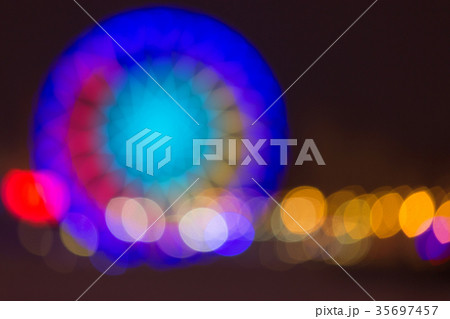 Defocused ferris wheel with colorful lights Defocused ferris wheel with colorful lights 35697457