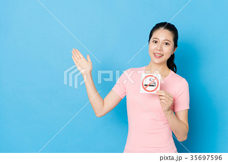 female teenager standing in blue background 35697596
