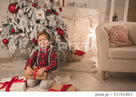 Young boy at home on Christmas evening 35701901