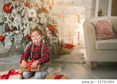 Young boy at home on Christmas evening 35701904
