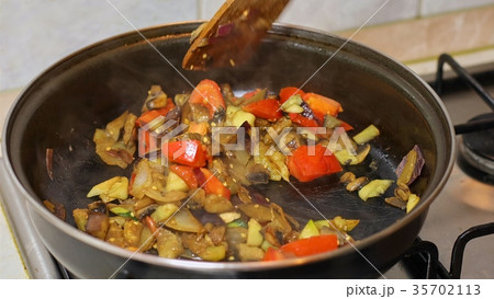 Preparing hot breakfast 35702113