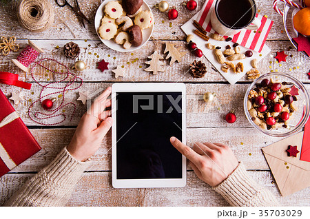 Christmas composition with tablet on a wooden 35703029