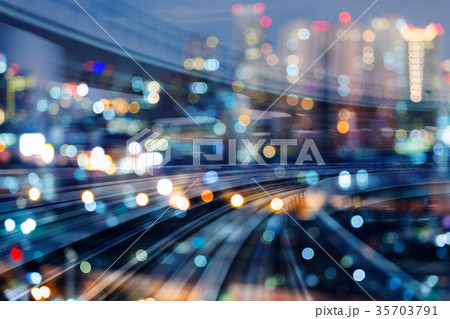 Motion blurred train curved with city bokeh light  35703791