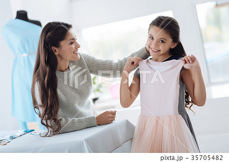 Positive young girl being happy about the dress 35705482