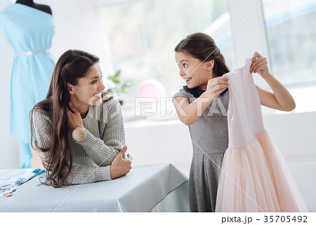 Happy excited girl taking a dress 35705492