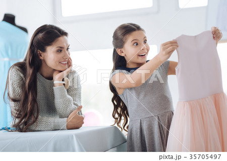 Cheerful beautiful woman watching her daughter 35705497