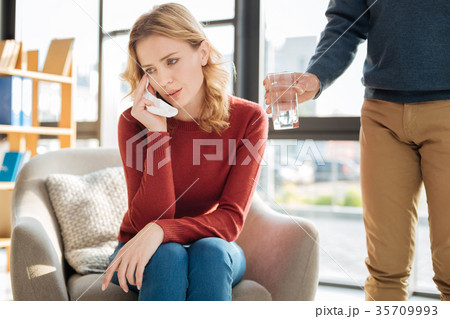 Pleasant young woman having personal problems 35709993