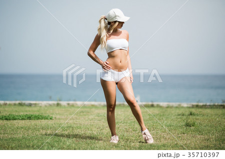 Full length side view portrait of a young sports 35710397
