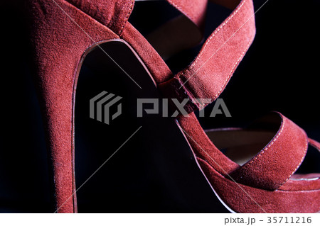 detail at red female high heels shoes on a black detail at red female high heels shoes on a black 35711216