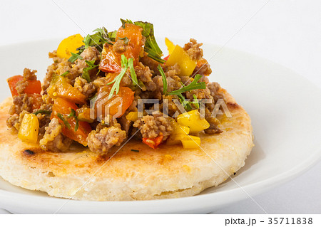 Colombian arepa topped with ground beef 35711838
