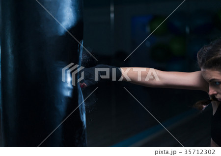 fighter boxer fit girl wearing hand bandage in fighter boxer fit girl wearing hand bandage in 35712302