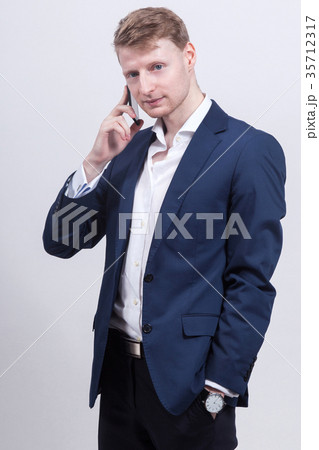 Picture of serious businessman standing with Picture of serious businessman standing with 35712317