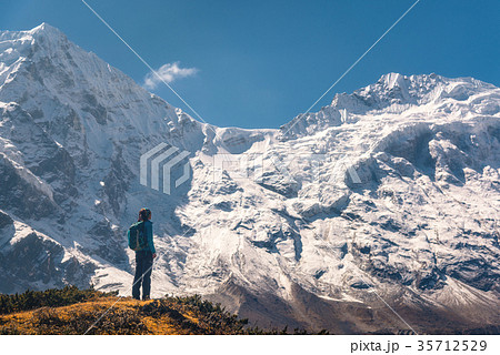 Standing young woman on the hill  35712529