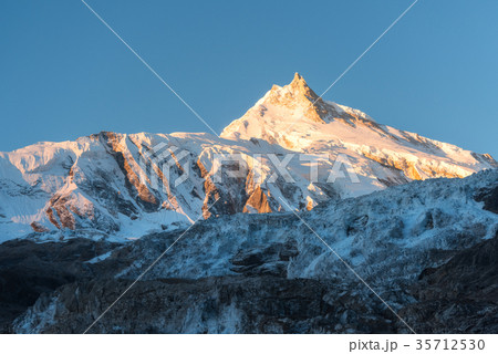 Beautiful view of snow-covered mountain at sunrise 35712530