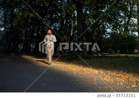 Running activity of mid aged man. 35713101