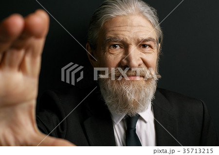 Close up portrait of wrinkled grey haired man. Close up portrait of wrinkled grey haired man. 35713215
