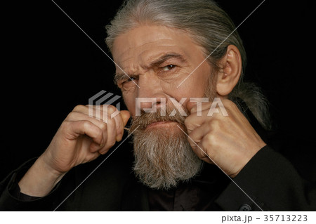 Close up portrait of aged grey haired man. Close up portrait of aged grey haired man. 35713223