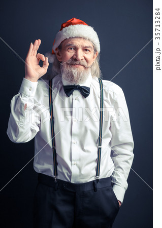New Year Santa in white shirt showing ok. New Year Santa in white shirt showing ok. 35713284
