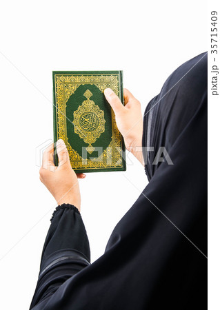 Koran in hand ,Quran in hand - holy book of Muslim Koran in hand ,Quran in hand - holy book of Muslim 35715409