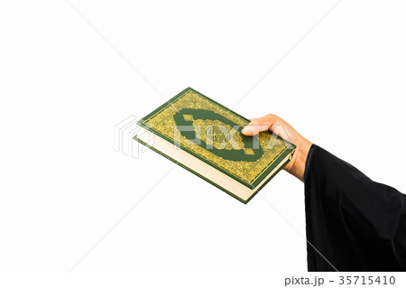 Koran in hand ,Quran in hand - holy book of Muslim Koran in hand ,Quran in hand - holy book of Muslim 35715410
