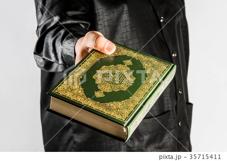 Koran in hand ,Quran in hand - holy book of Muslim 35715411