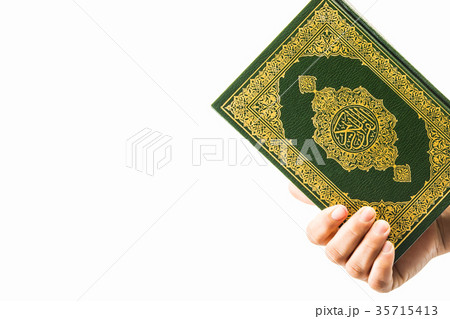 Koran in hand ,Quran in hand - holy book of Muslim Koran in hand ,Quran in hand - holy book of Muslim 35715413