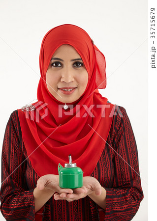 woman holding pelita woman holding pelita 35715679