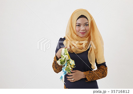 malay woman showing ketupat 35716812