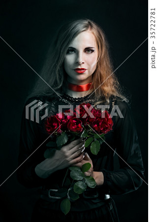Beautiful witch with a roses 35722781