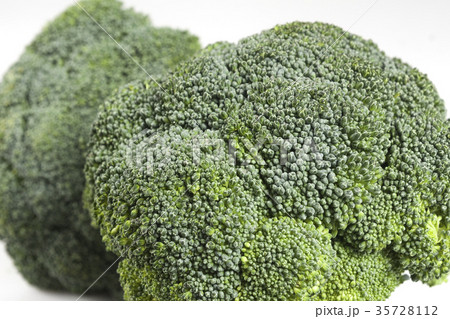 Closeup at two broccoli heads. Closeup at two broccoli heads. 35728112