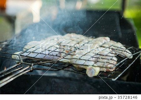 Roast chicken on grill. Fried chicken on the 35728146
