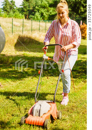 Gardening. Mowing lawn with lawnmower 35729349