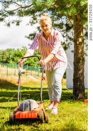 Gardening. Mowing lawn with lawnmower Gardening. Mowing lawn with lawnmower 35729350