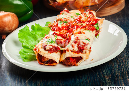 Traditional mexican enchiladas with chicken meat 35729721