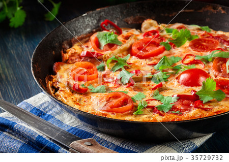 Frittata made of eggs, sausage chorizo Frittata made of eggs, sausage chorizo 35729732