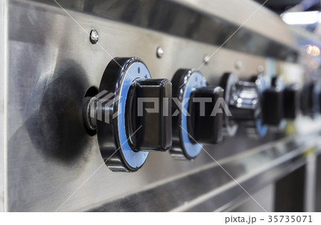 Close up switch of Kitchen burning gas cooker 35735071