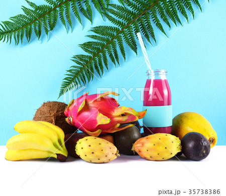 Pink smoothie with tropical fruits. Pink smoothie with tropical fruits. 35738386