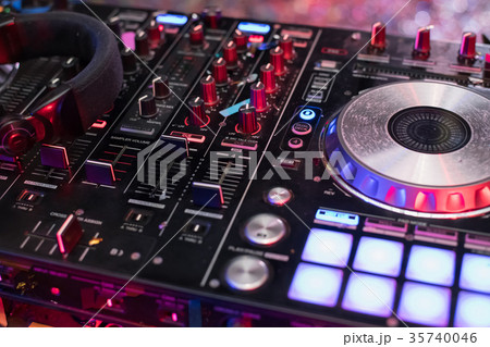 DJ is rhythm music with Controller and mixer. 35740046