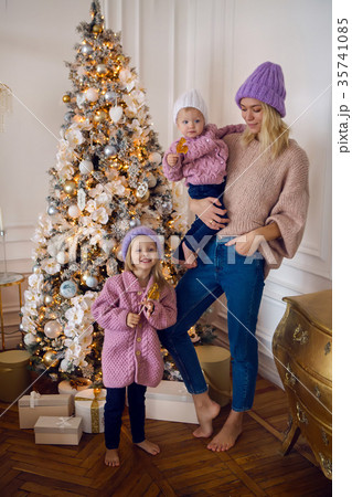 mother with two daughters standing by the 35741085