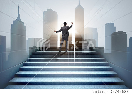 Businessman climbing up challenging career ladder 35745688
