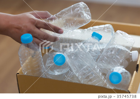 man hand putting plastic reuse  for recycling  35745738