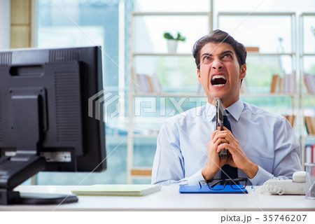 Angry businessman with gun thinking of committing Angry businessman with gun thinking of committing 35746207
