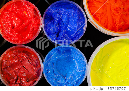 top view of Plastisol ink in white plastic cans top view of Plastisol ink in white plastic cans 35746797