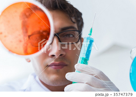 Chemist working in the laboratory with hazardous Chemist working in the laboratory with hazardous 35747379