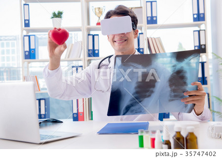 Doctor working with virtual VR reality glasses 35747402