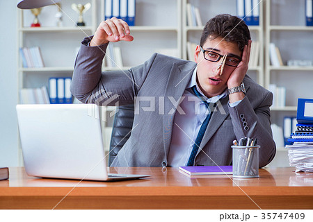 Businessman sweating excessively smelling bad in 35747409