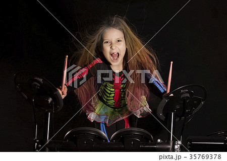 Little caucasian girl drummer with multicolored Little caucasian girl drummer with multicolored 35769378