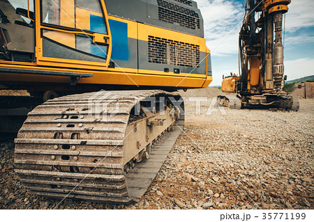 Details of excavator tracks on construction site 35771199