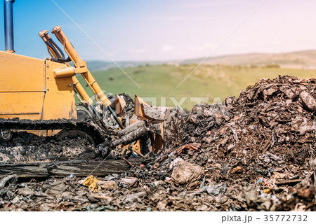 industrial bulldozer leveling garbage grounds industrial bulldozer leveling garbage grounds 35772732