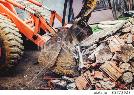 bulldozer demolishing concrete brick walls bulldozer demolishing concrete brick walls 35772923